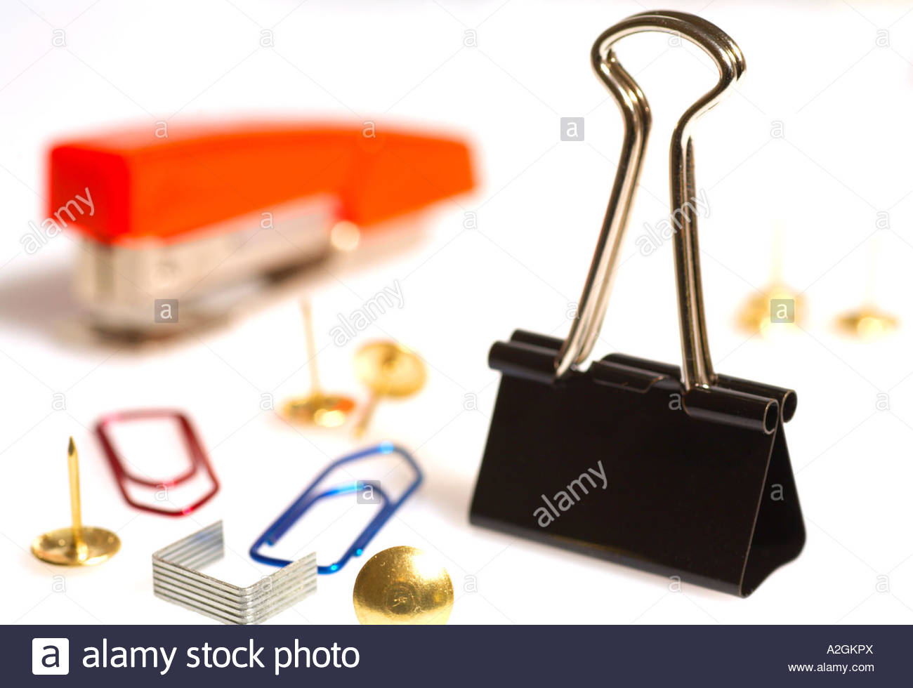 Paperclips, drawing pins, staples and stapler, bulldog clip Stock Photo