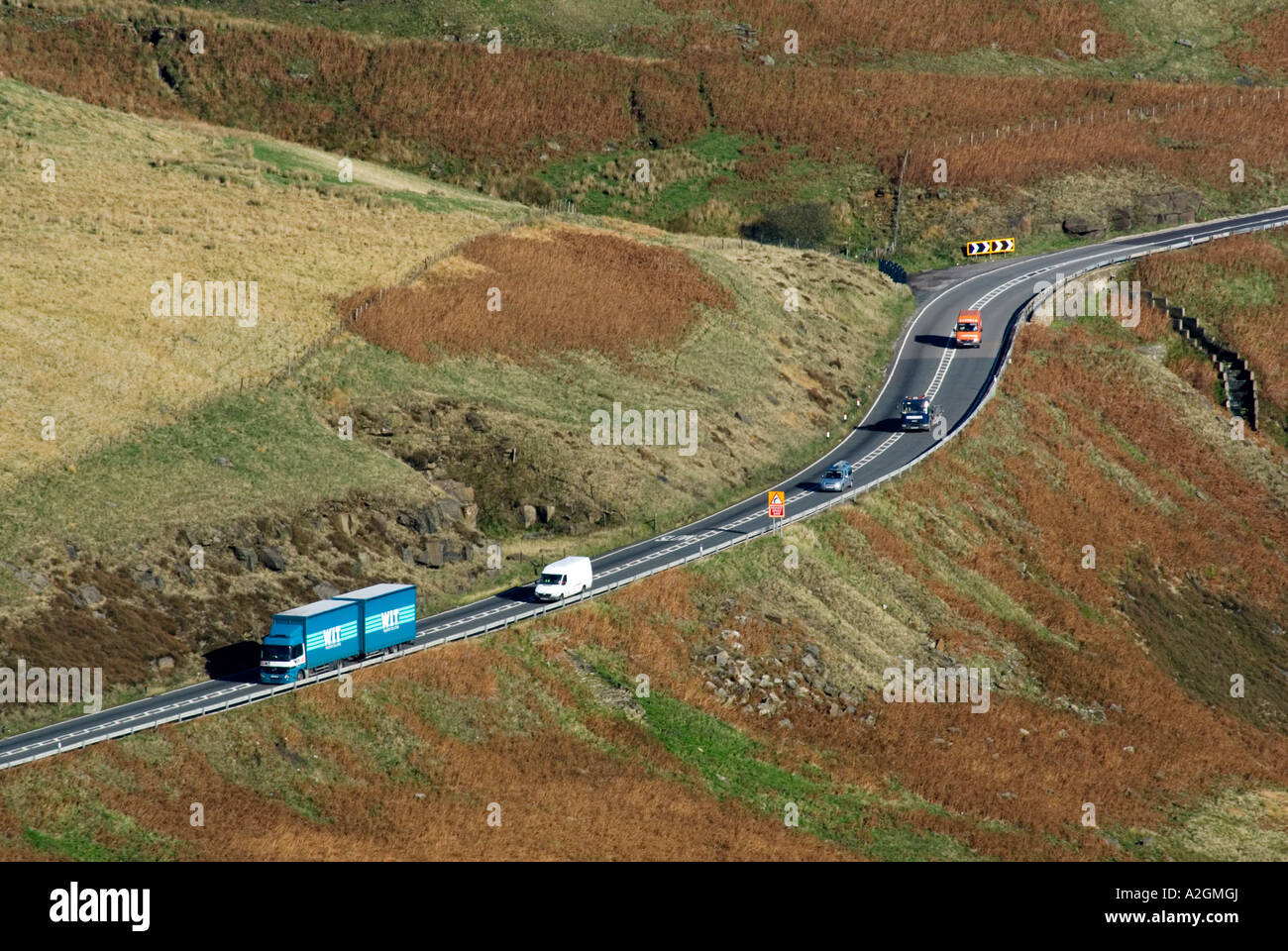 Traffic on the A628 route crossing the Woodhead Pass in the Longdendale Valley Derbyshire Yorkshire border Stock Photo