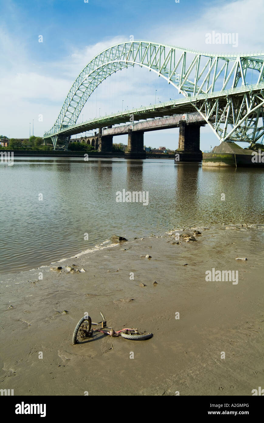 Runcorn Widnes Bridge spanning the River Mersey in Cheshire with debris in the foreground. Stock Photo