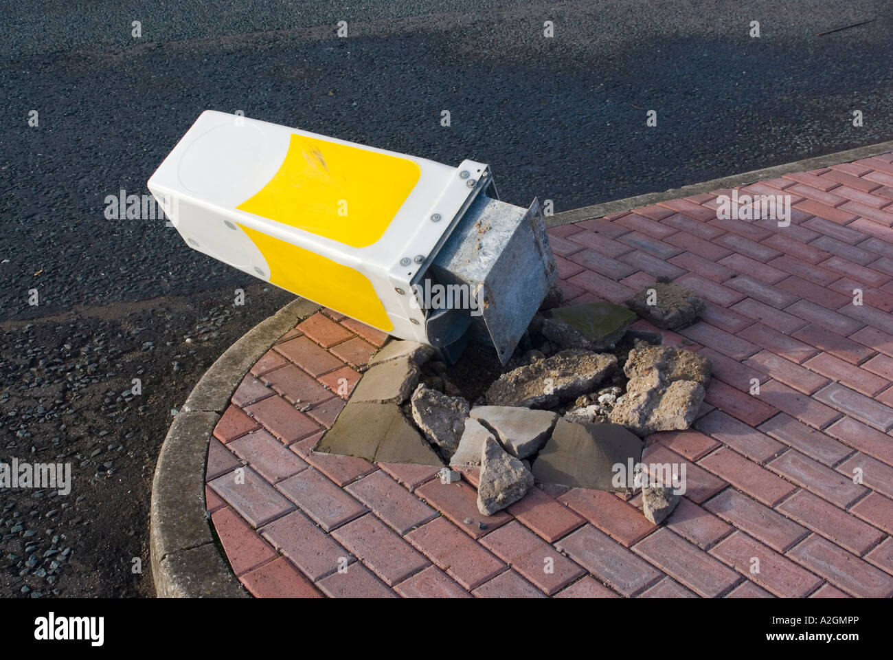 Illuminated traffic bollard vandalised or knocked down in an accident Stock Photo
