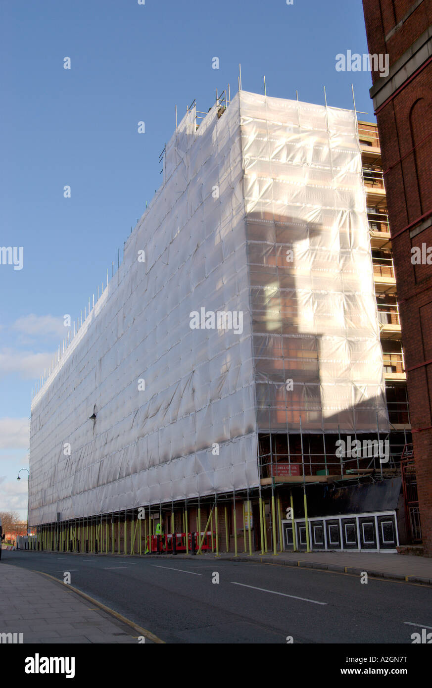 Old mill building being renovated and redeveloped in Pollard Street East Manchester UK Stock