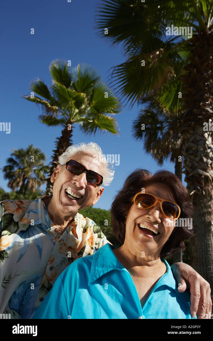 Senior Hispanic couple laughing outdoors Stock Photo - Alamy