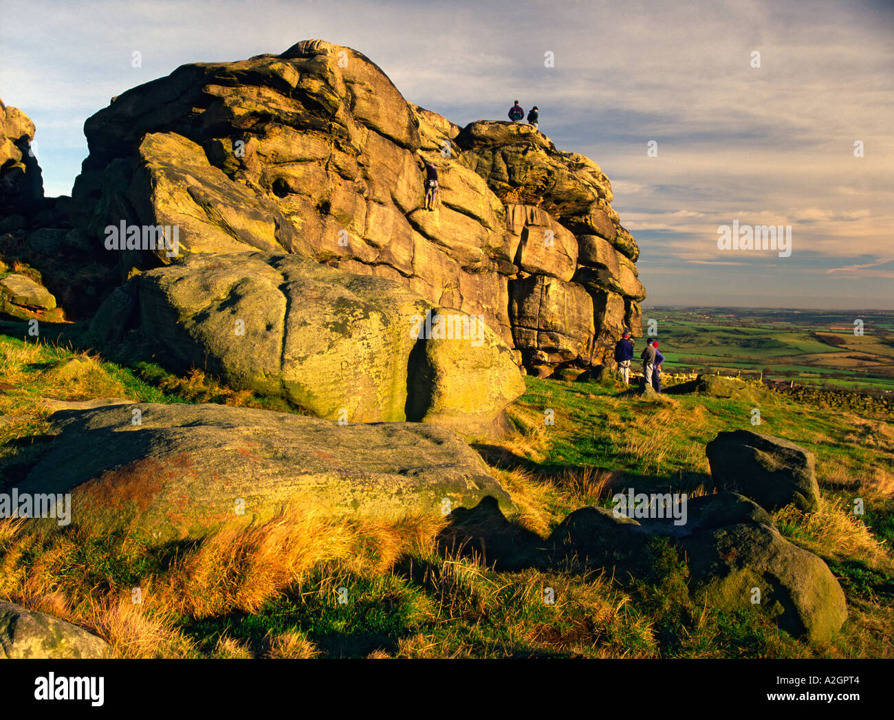 Climbers on Almscliff crag near Harrogate, North Yorkshire. Stock Photo