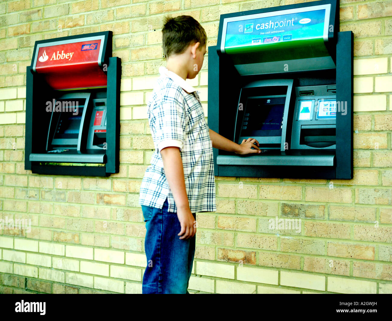 https www alamy com stock photo young boy using atm bank cash point model released 10520488 html