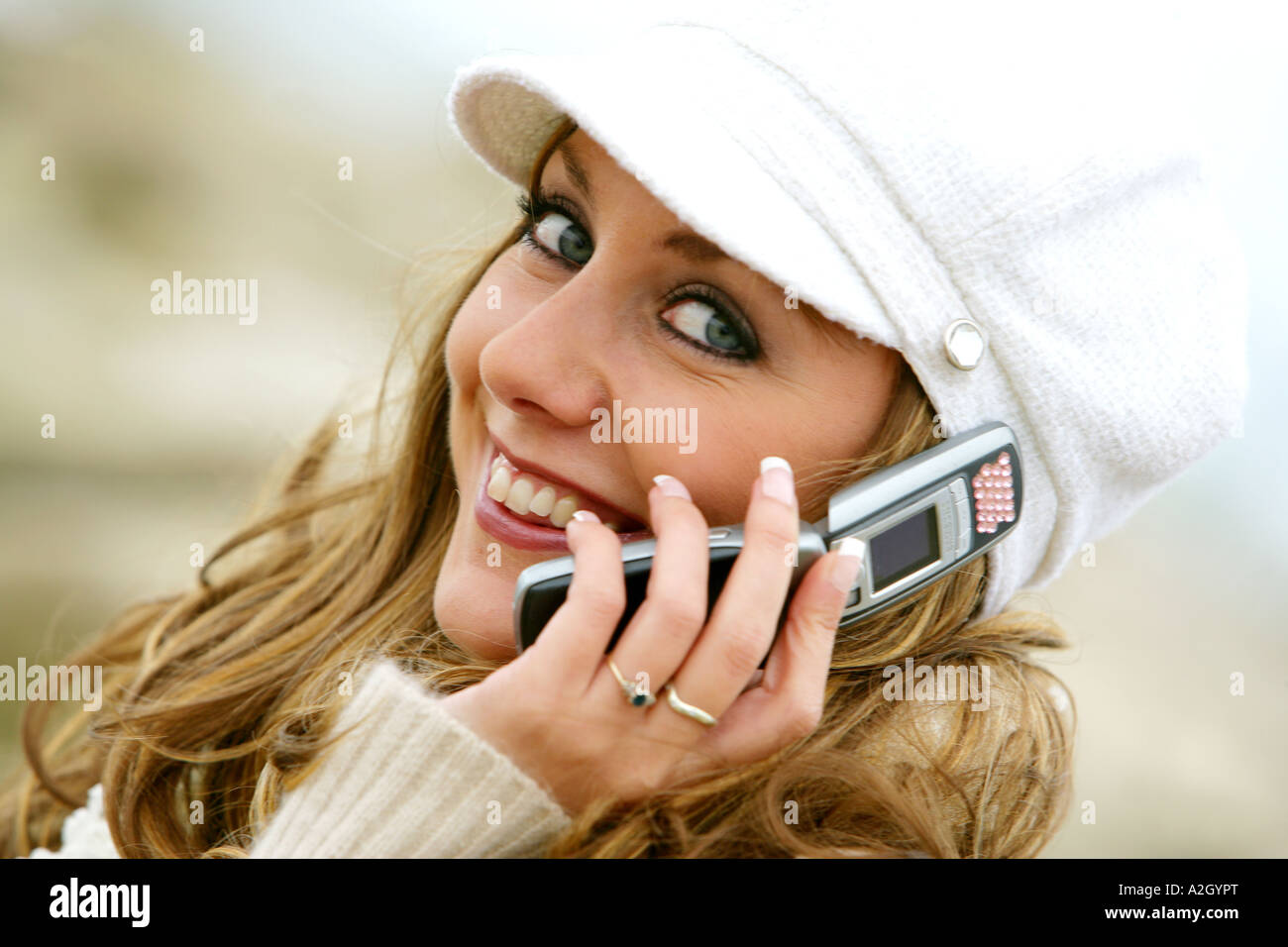 Young Woman Alone Making A Call On A Retro Cell Phone While Walking On ...