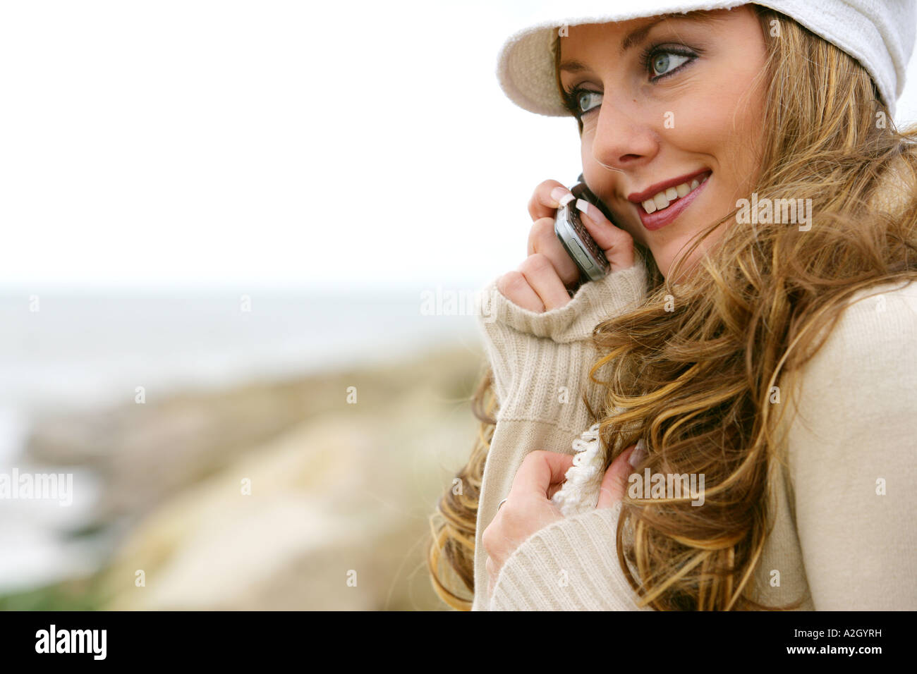 Young Woman Alone Making A Call On A Retro Cell Phone While Walking On ...