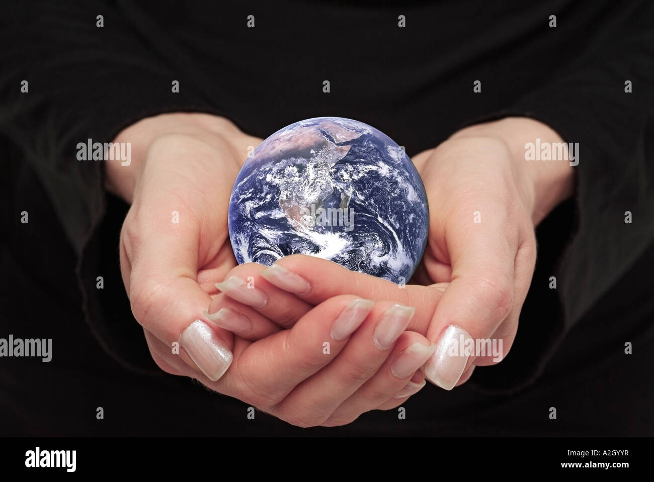 Female Hands Holding Planet Earth Stock Photo