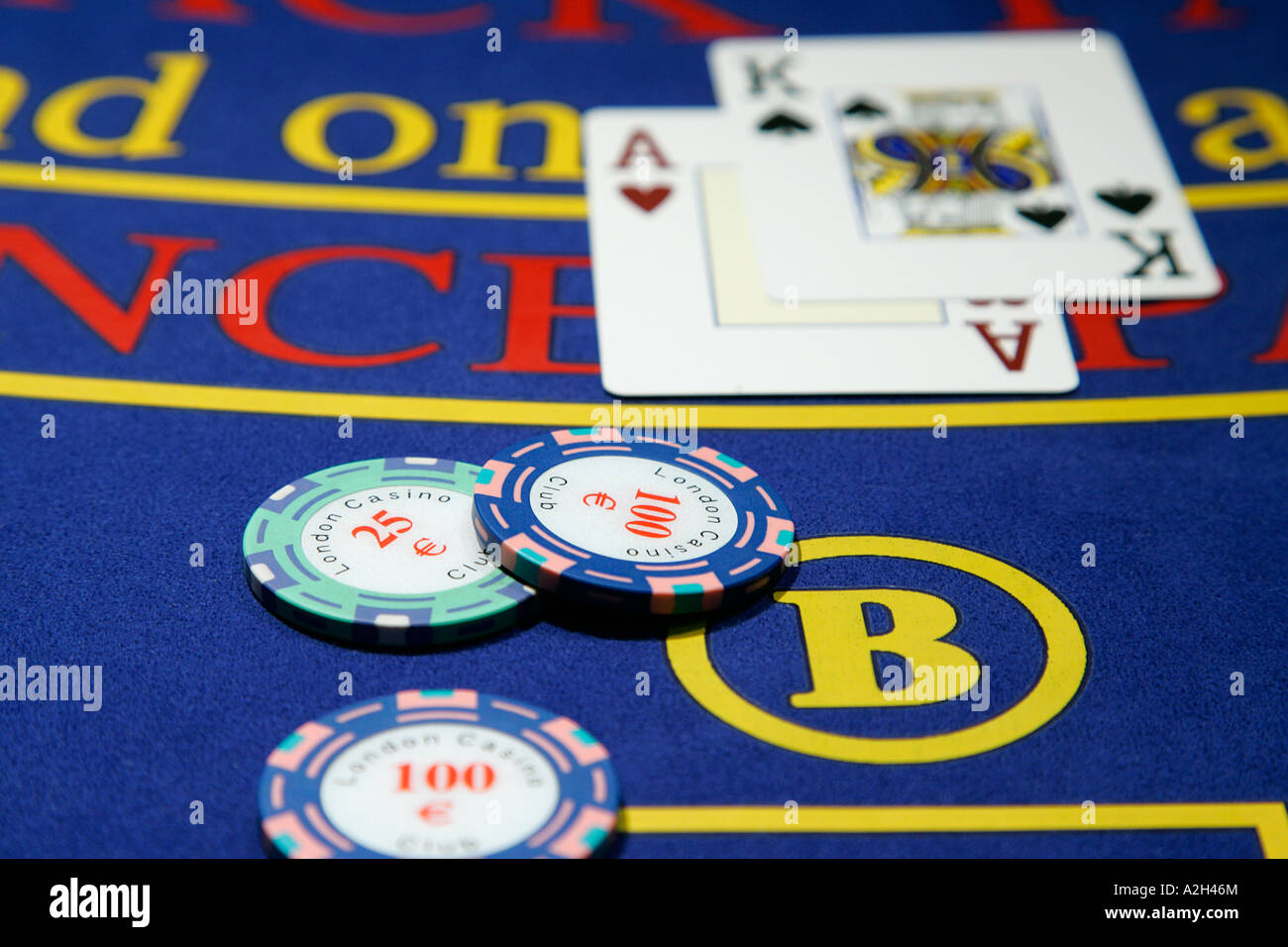 Close up of a casino chip playing cards four aces ace card symbol of win luck success triumph winning winner poker black jack Stock Photo