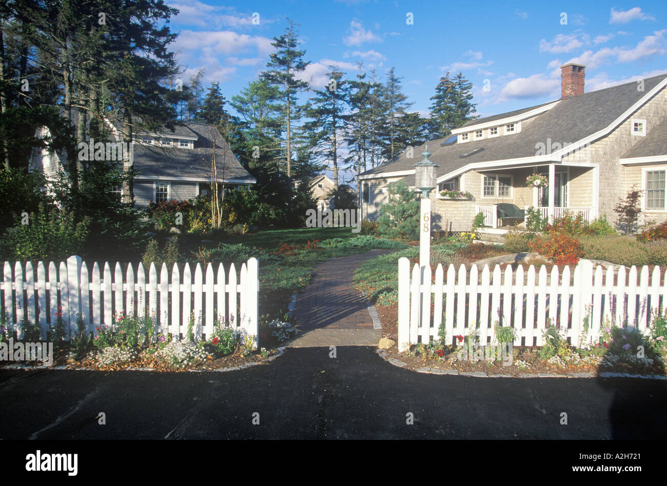 House with white picket fence Spruce Head Harbor Maine 2002 Stock Photo