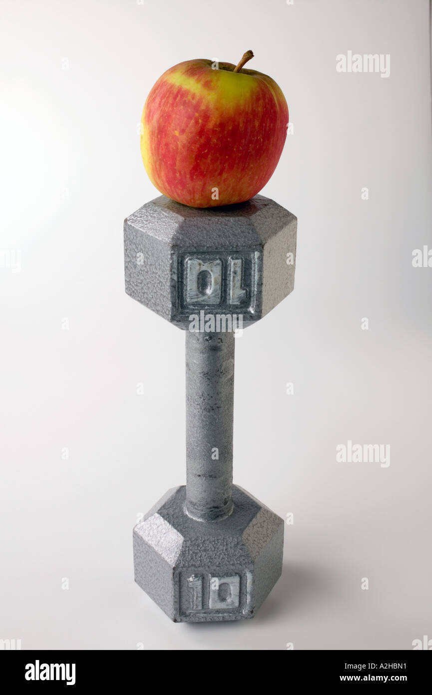 Apple on hand weight Stock Photo