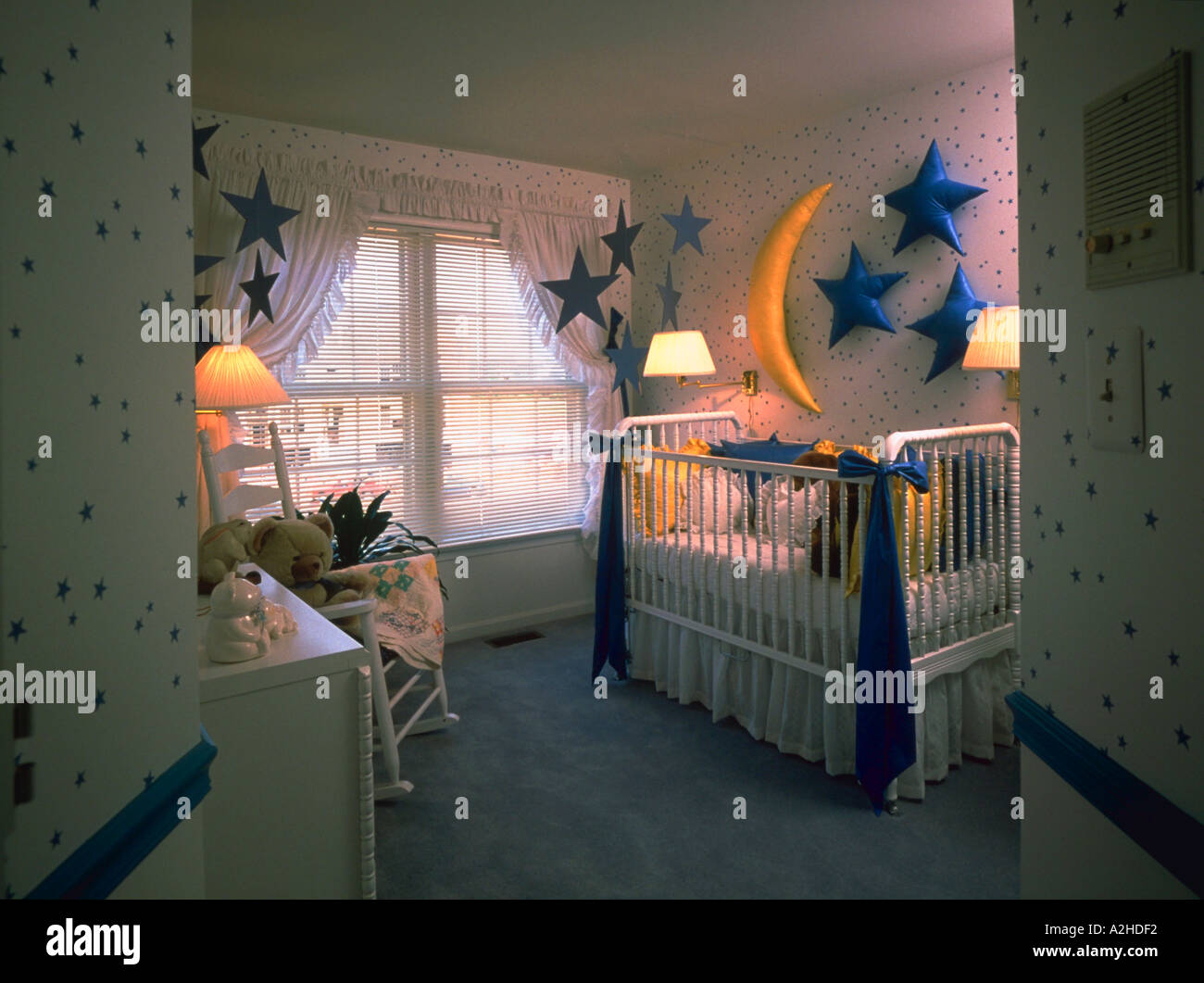A Baby Room Adorned With Star Wallpaper And Stuffed Stars And A Stuffed Moon On The Wall Stock Photo Alamy