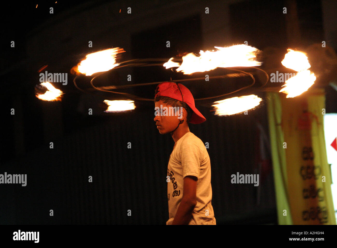 Twirling the flames on his head, in the great Kandy Esala Perahera festival in Kandy, Sri Lanka Stock Photo