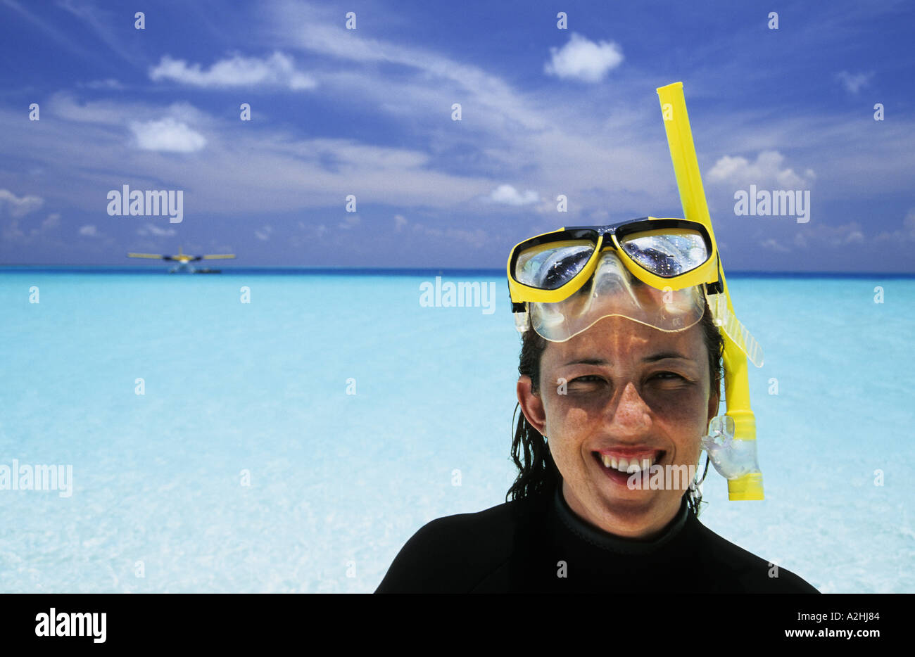 Maldives Baa atoll Woman with snorkeling equipment Stock Photo Alamy