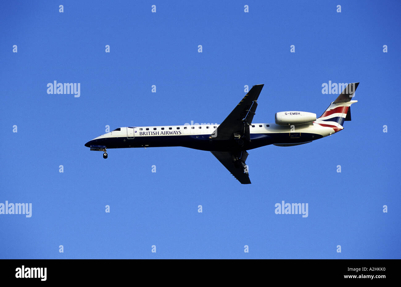 British Airways Embraer 145 approaching Birmingham International Airport, West Midlands, England, UK Stock Photo