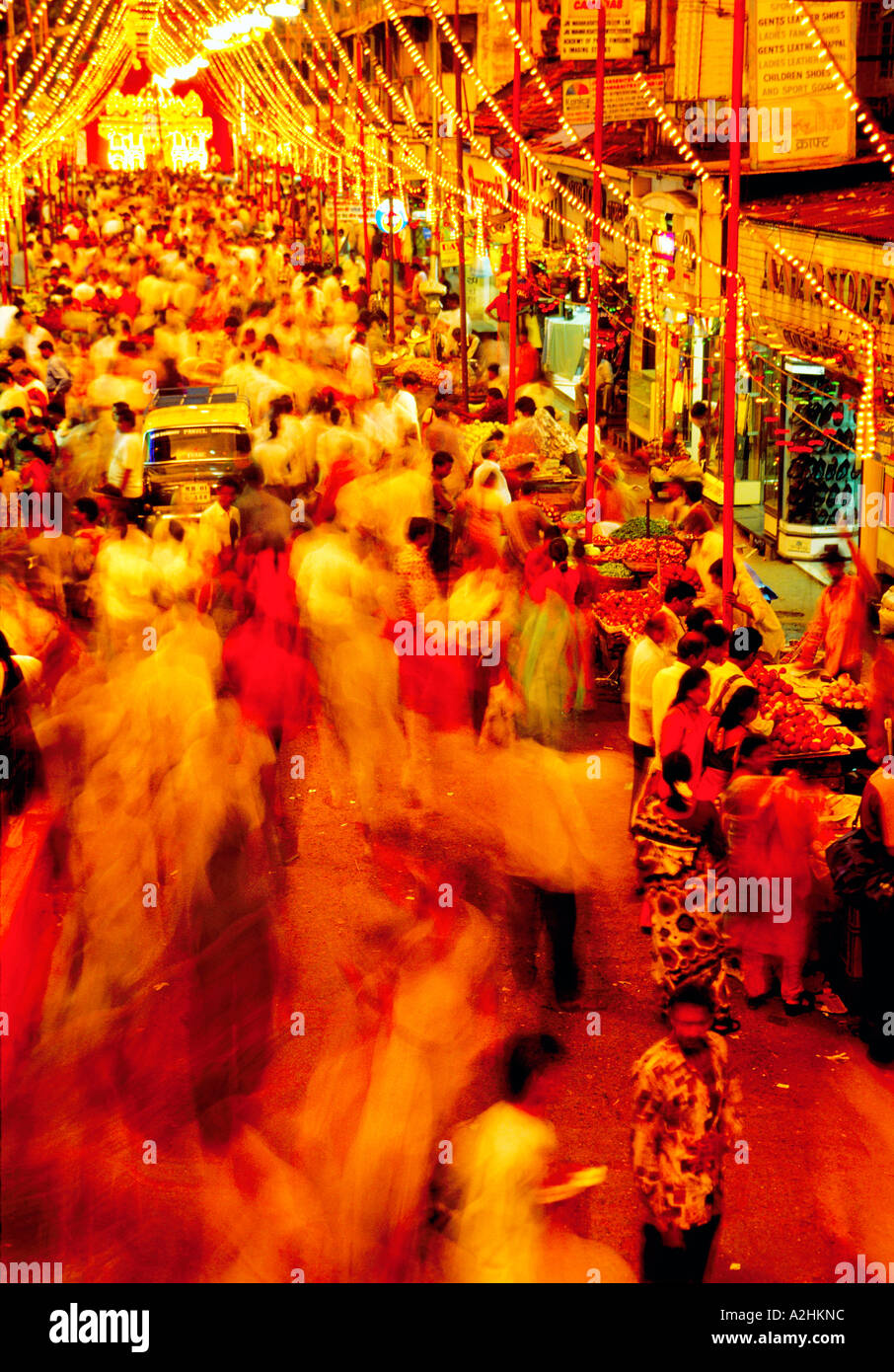 Night shot of Surging crowds of people doing evening shopping at Dadar West Street Market.  Mumbai India Asia Stock Photo