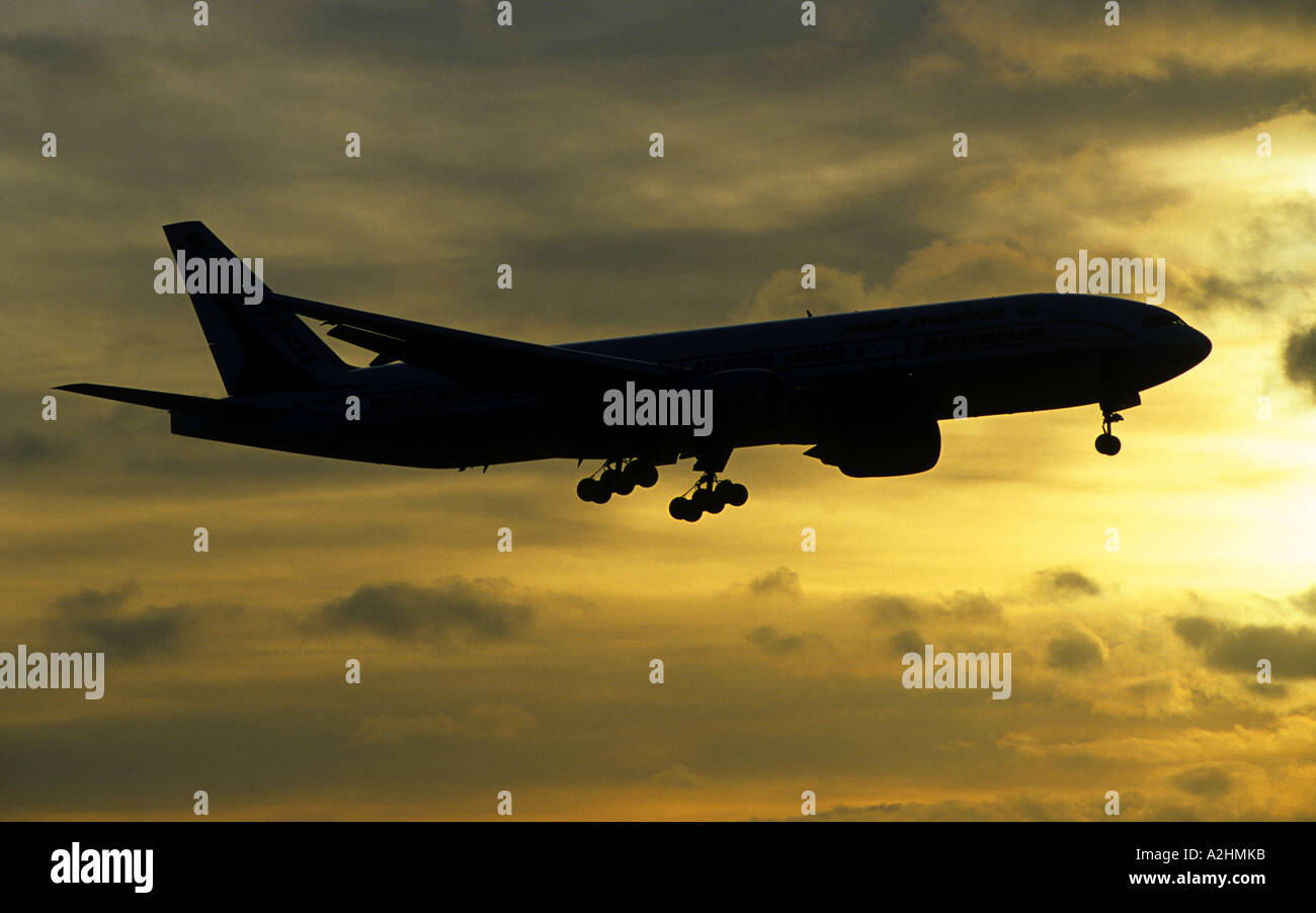 Air India Boeing 777 landing at Birmingham International Airport at sunset, West Midlands, England, UK Stock Photo