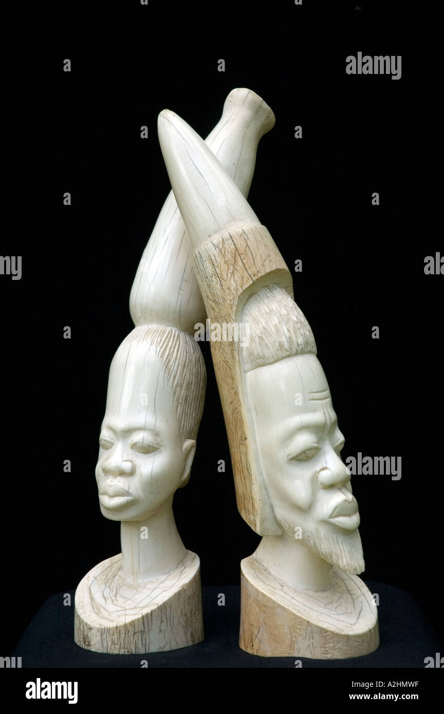 Carved ivory figurines of a stylised African man and woman. DSC 8194