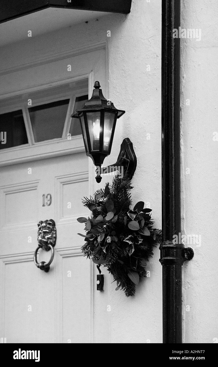Christmas wreath hung by front door, UK Stock Photo