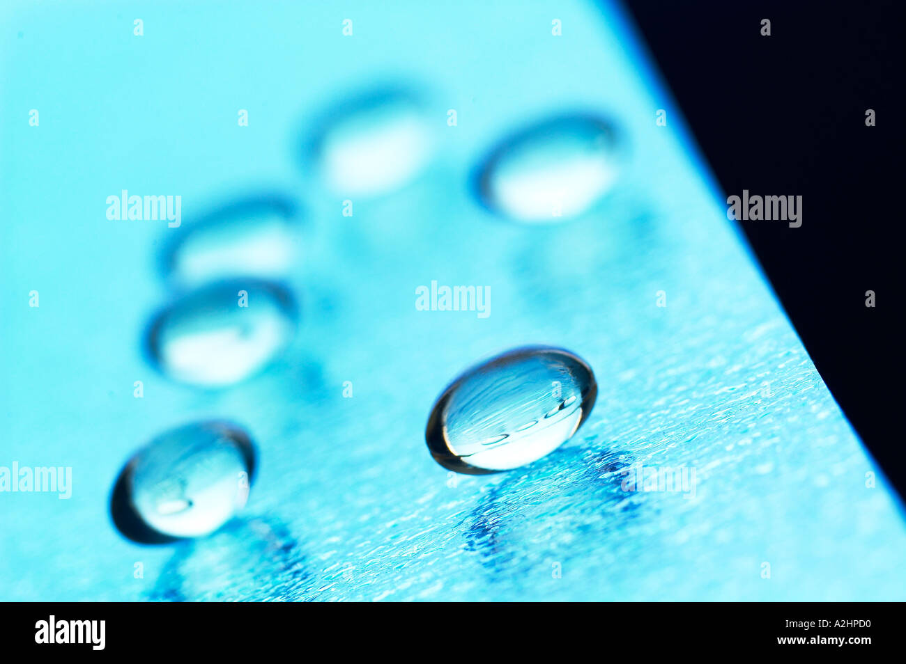 Landscape shot of star flower oil capsules arranged on  textured glass shot with shallow focus Stock Photo