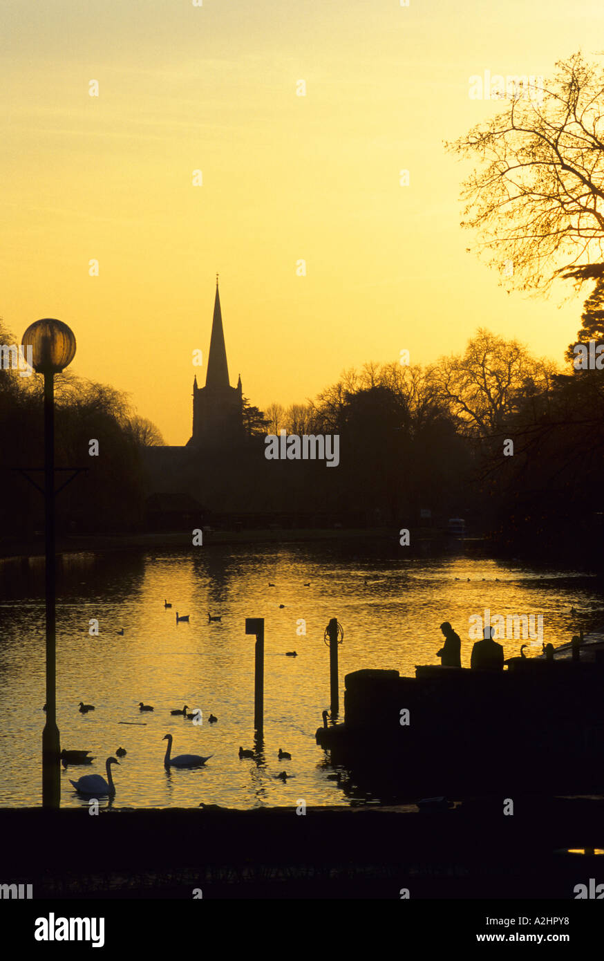 River Avon and Holy Trinity Church at sunset in winter, Stratford-upon-Avon, Warwickshire, England, UK Stock Photo