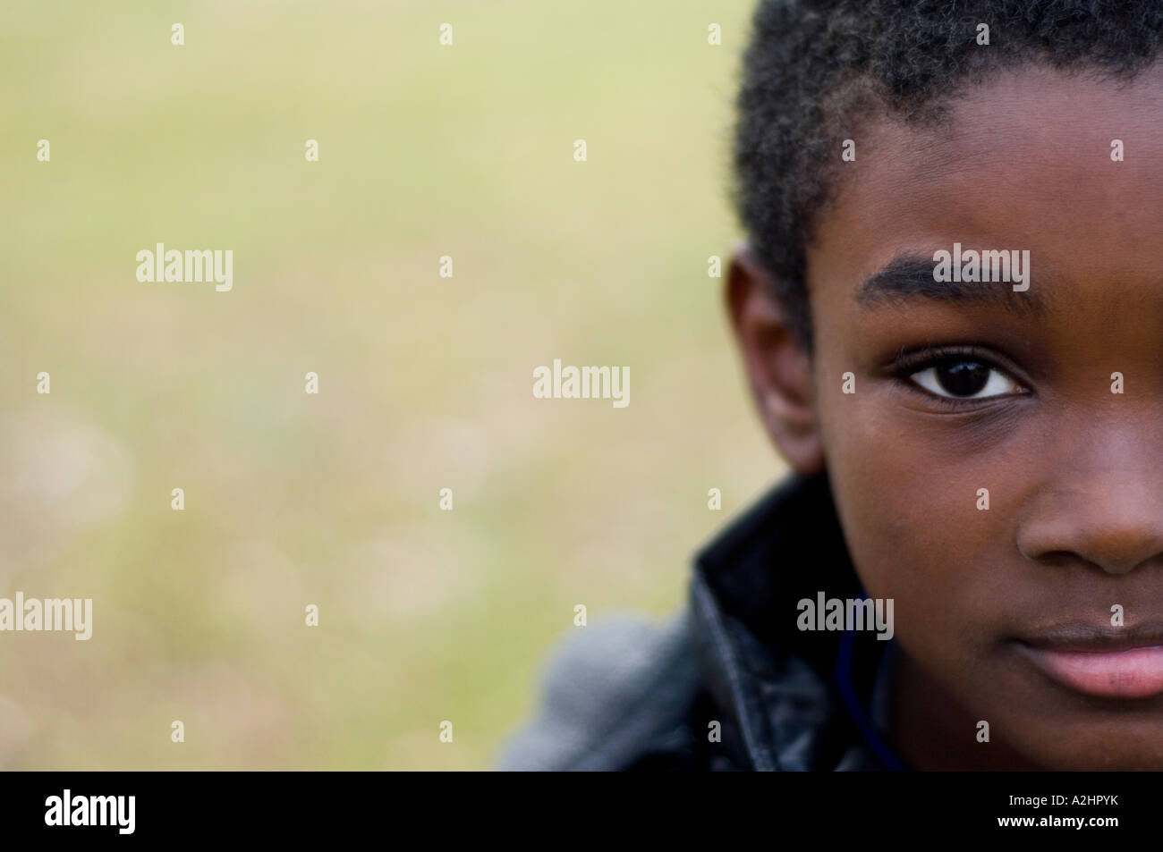 Close up of a young African American boy outdoors Stock Photo