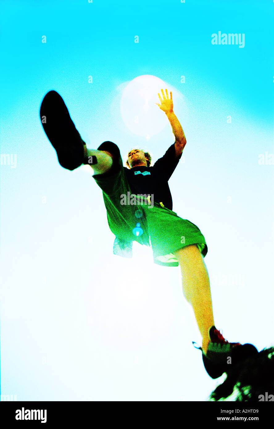 Male age 2025 rock jumping, the Image is color and shot from below