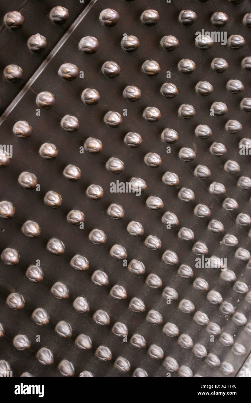 Studs on a metal door in Florence, Tuscany, Italy Stock Photo