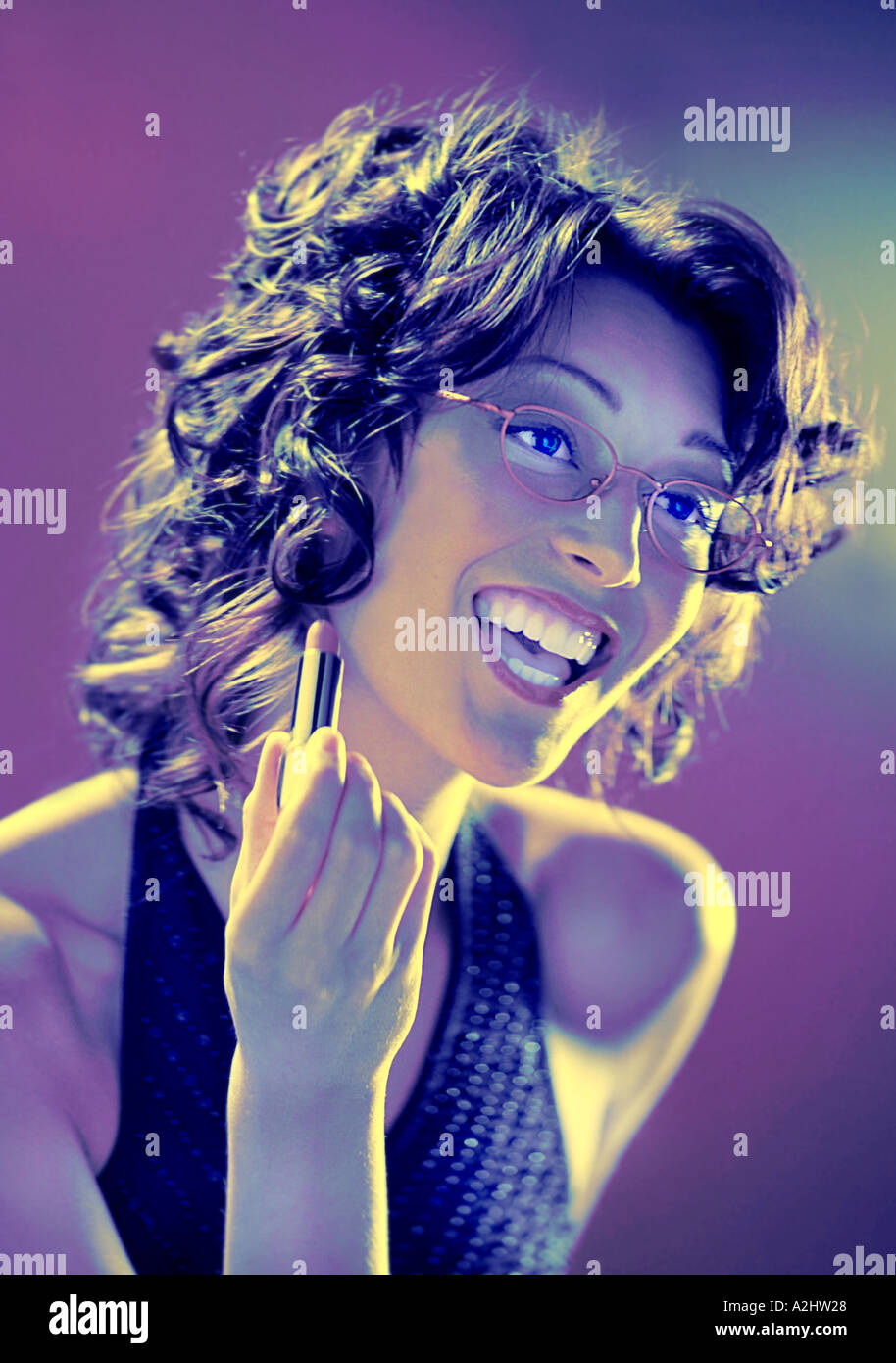 Beauty shot of a woman applying makeup Stock Photo - Alamy
