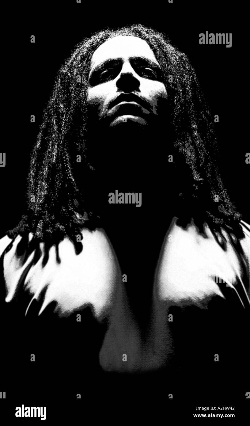 Male athlete age 20-25 with dreadlocks looking into camera, the Image is in portrait format and black and white. Stock Photo