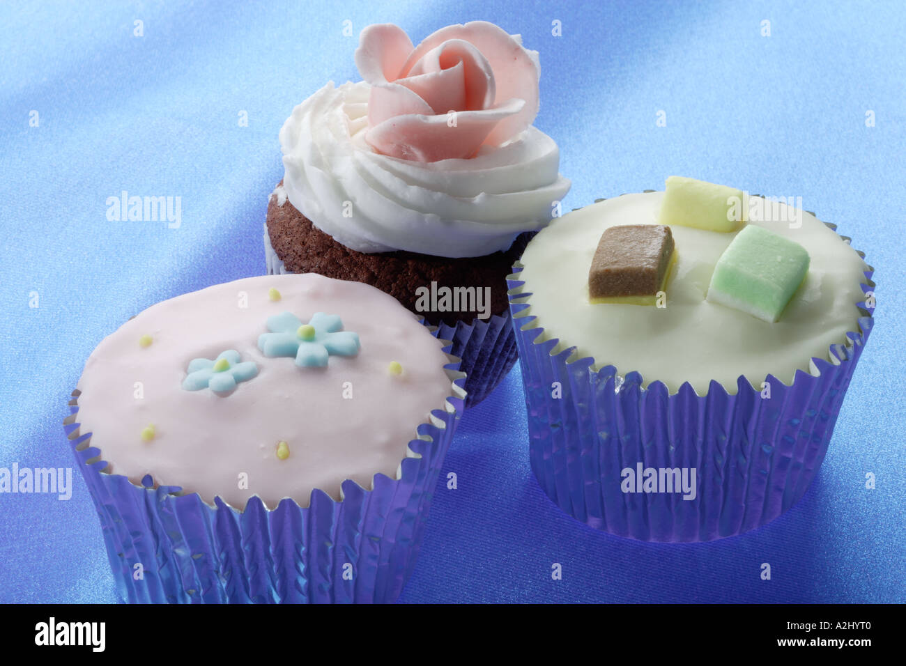 Sponge cup cakes with icing Stock Photo Alamy