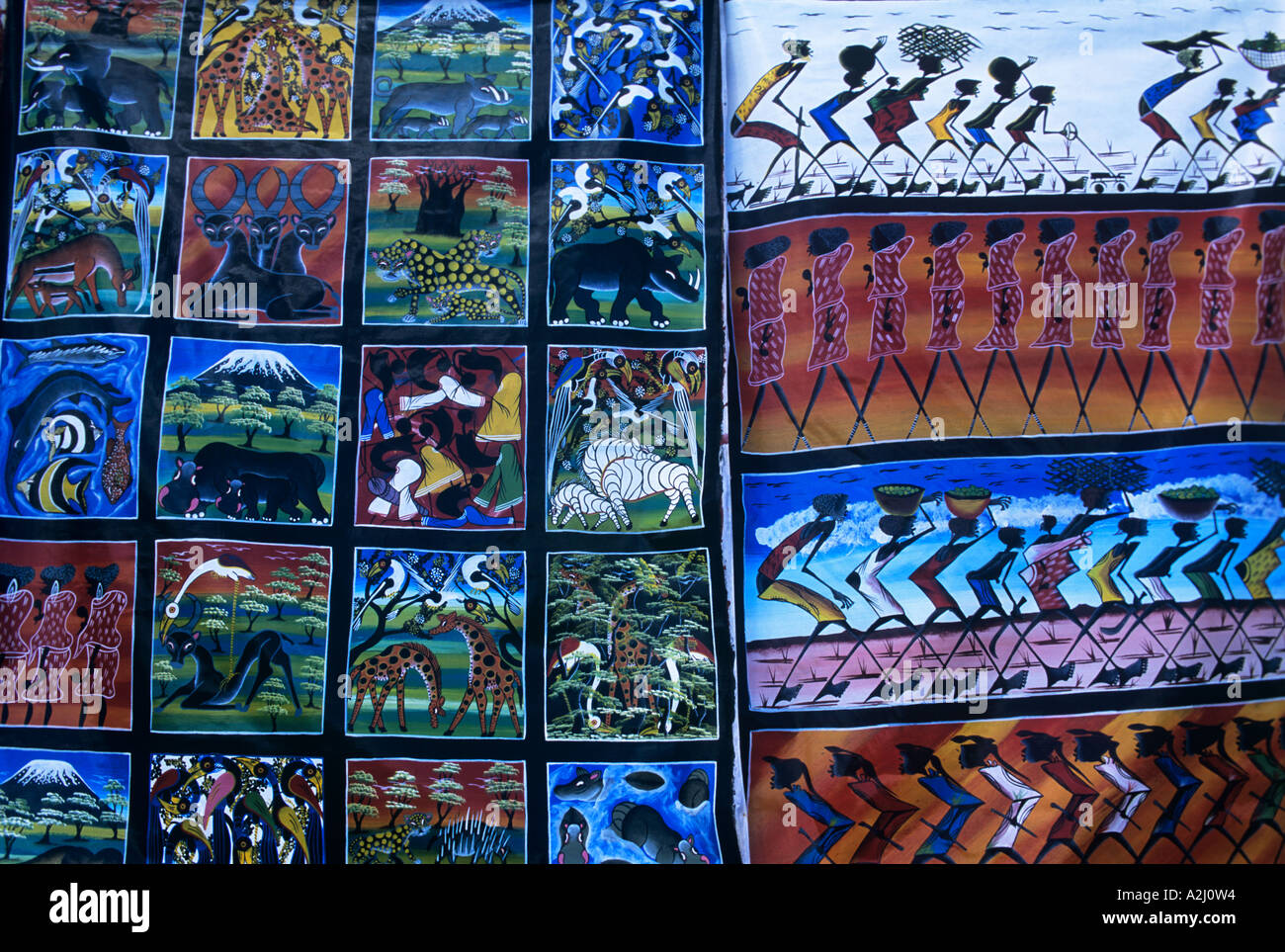 Vivid paintings in the popular Tingatinga style by the painter calling himself Cheti on display at the Zanzibar waterfront Stock Photo