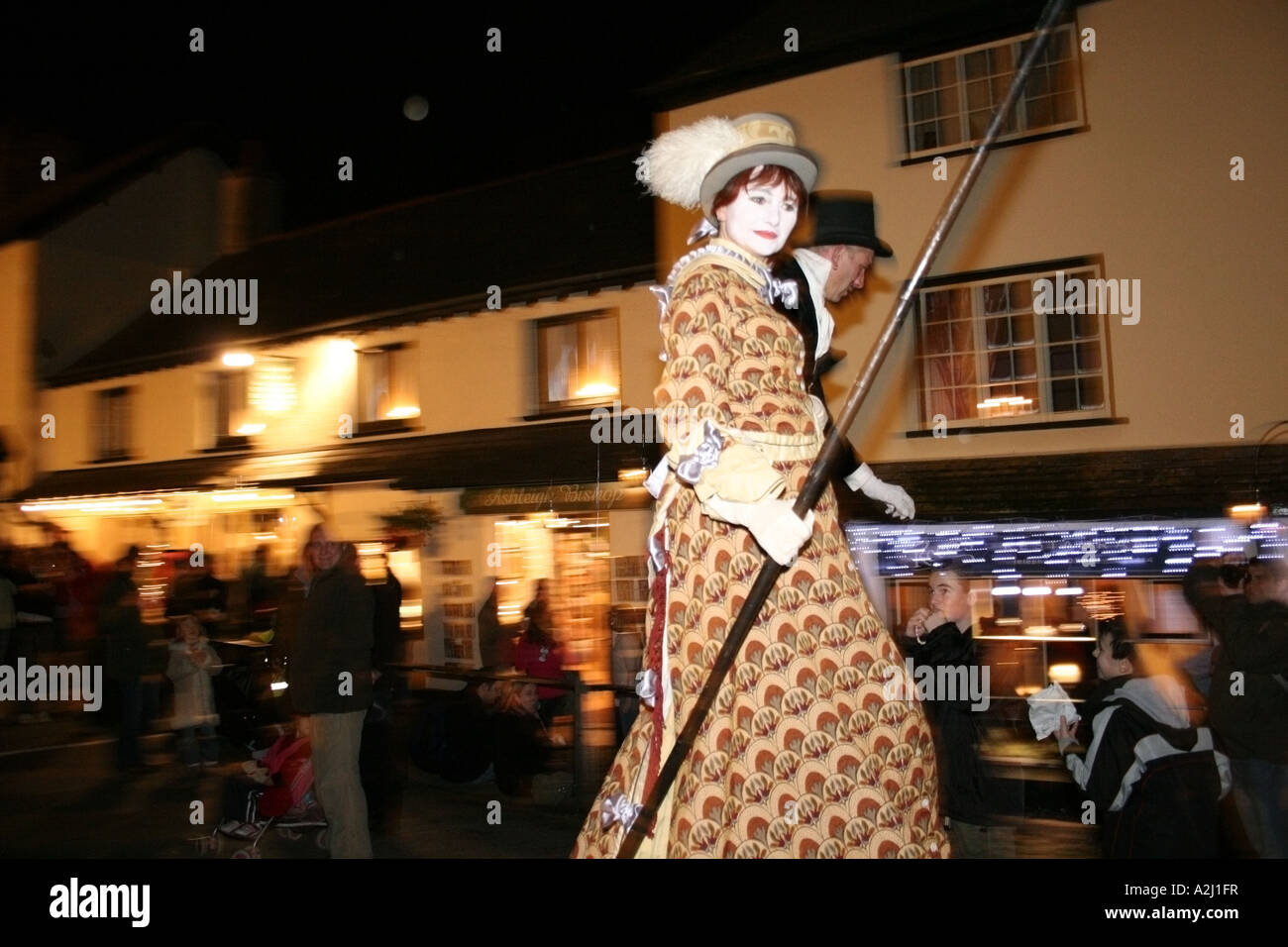 Stilt walkers taking part in the annual Candlelight festival Dunster Summerset Stock Photo