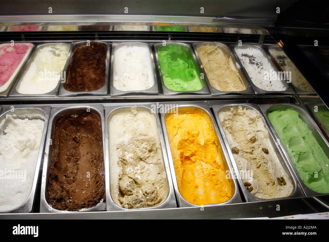 Ice cream tubs in window display Stock Photo