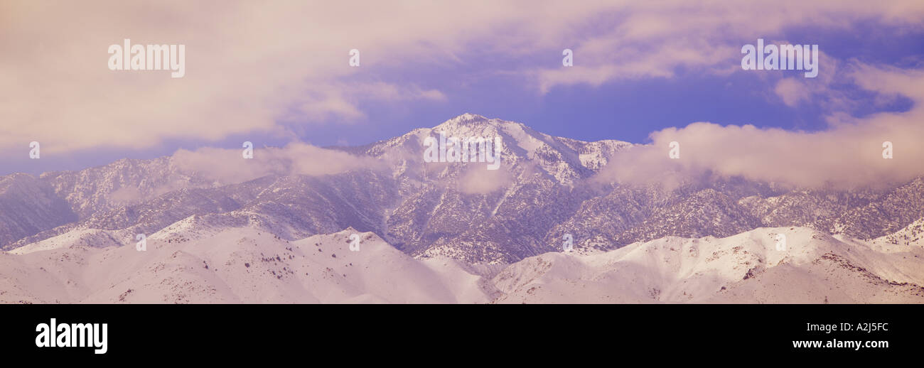 Snowy mountains and clouds in Sierra Nevada Mountains California Stock Photo