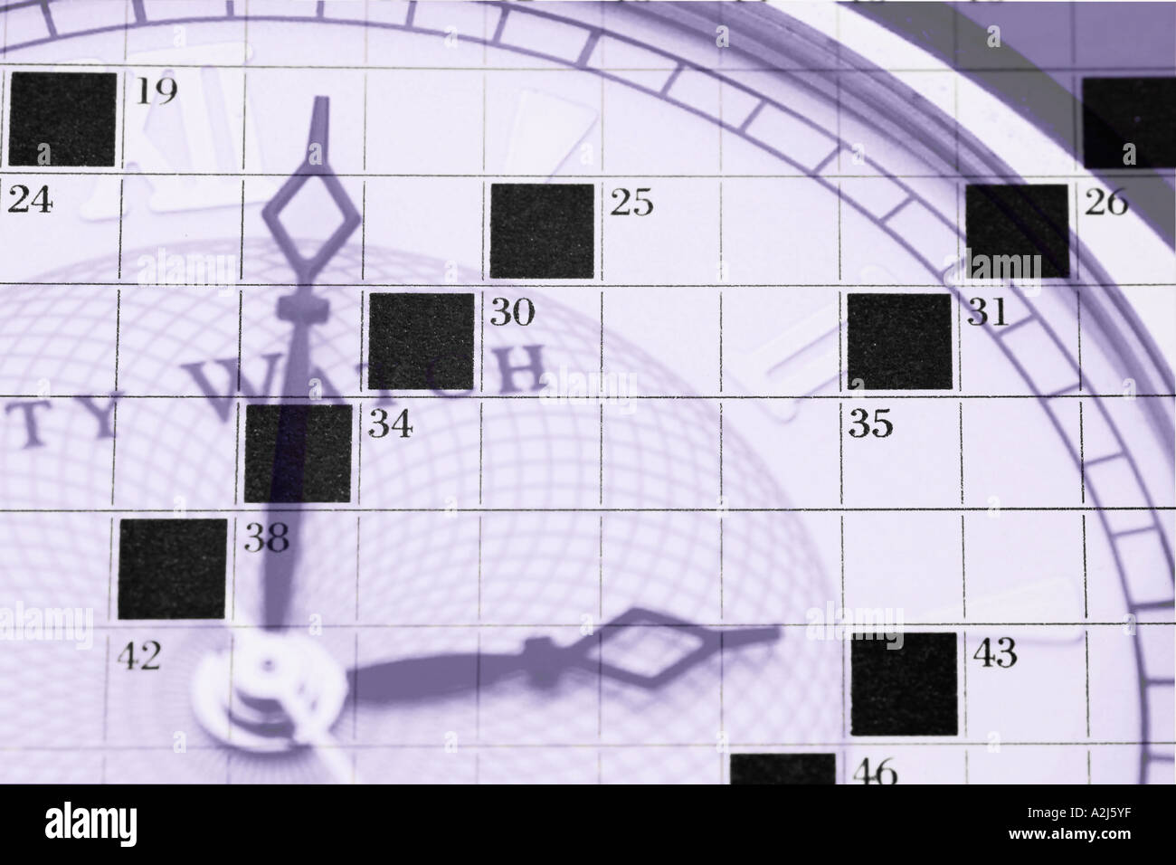 Composite of a crossword page and a watch Stock Photo Alamy