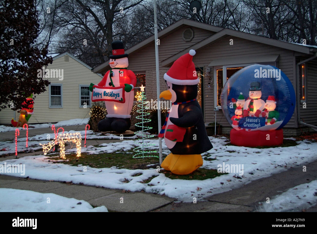 Christmas decorations at night on a house provide a festive spirit Stock Photo