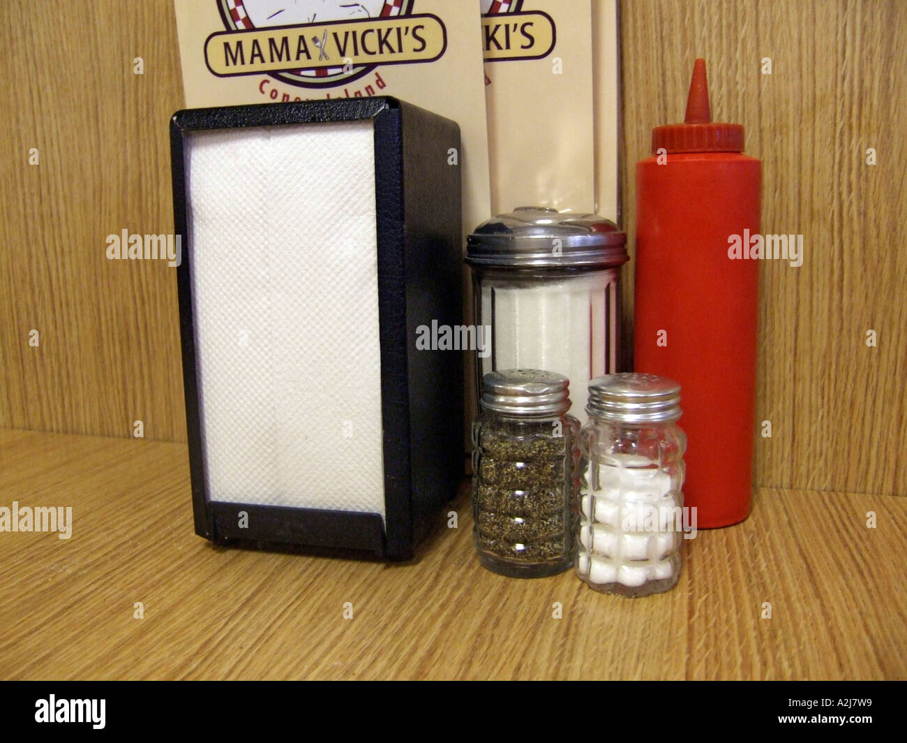 Food condiments sit on a table in a restaurant for the convenience of the customer Stock Photo