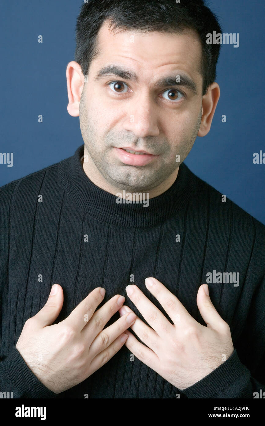 Man covering his eyes with his hands Stock Photo
