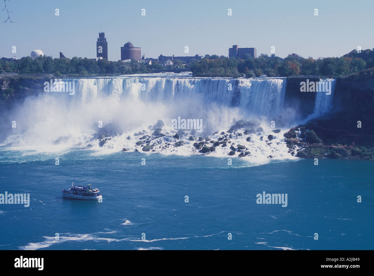 The American side of Niagara Falls as seen from Canada The tour boat Maiden of the Mist passes by Stock Photo