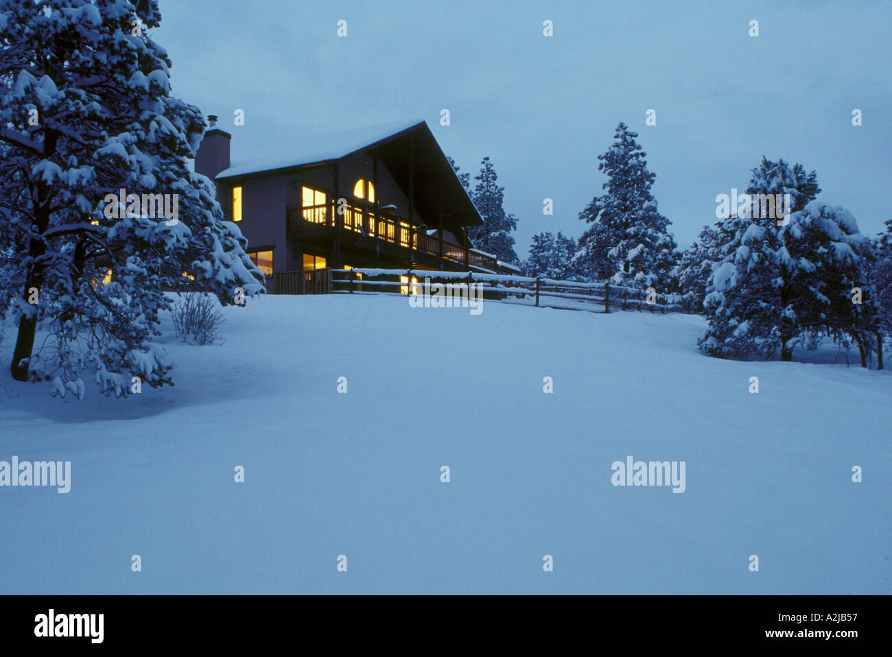 A mountain home in the winter snow at evening Durango Colorado Stock