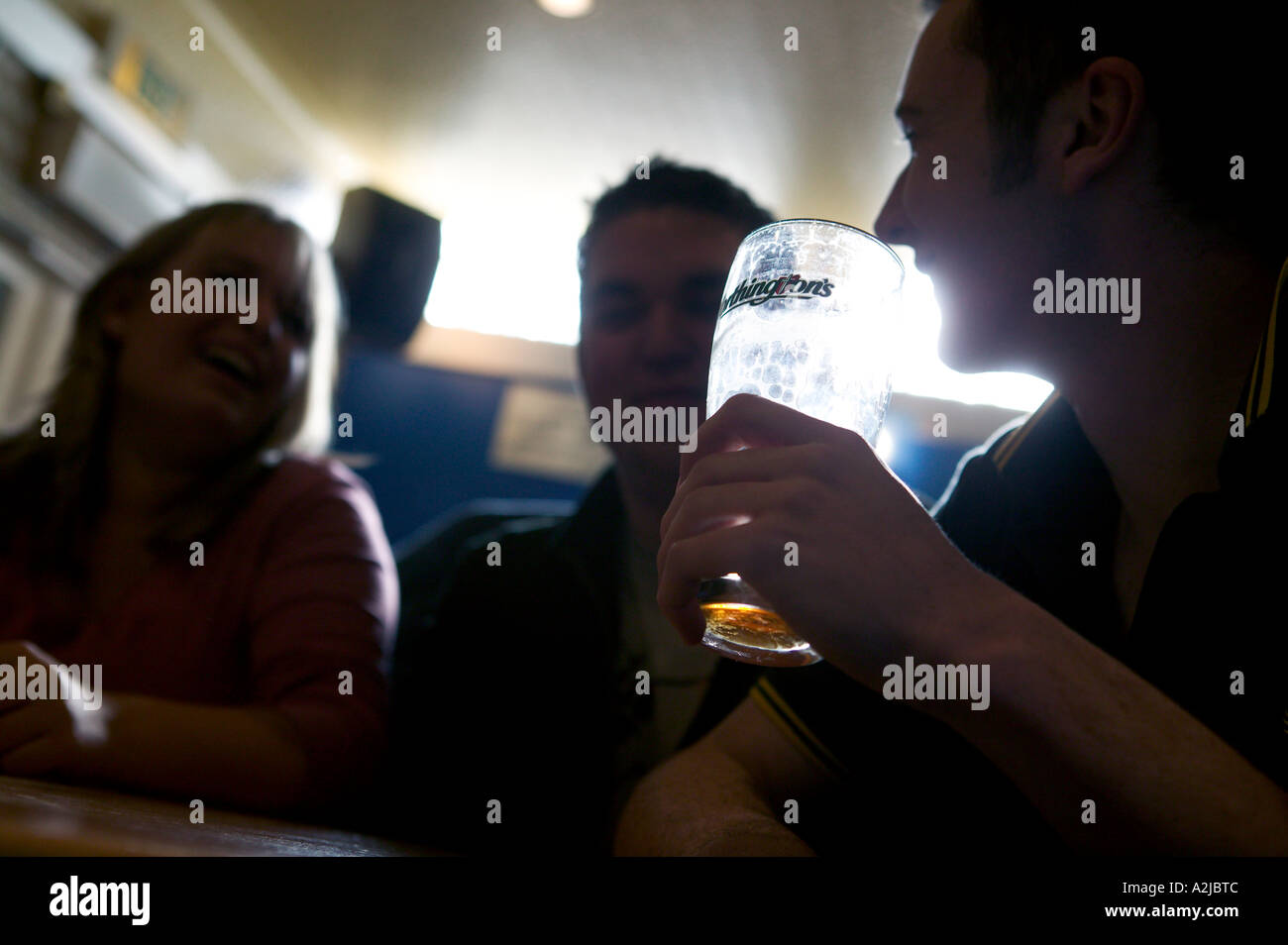 Students drink lager in a university bar Birmingham UK Stock Photo
