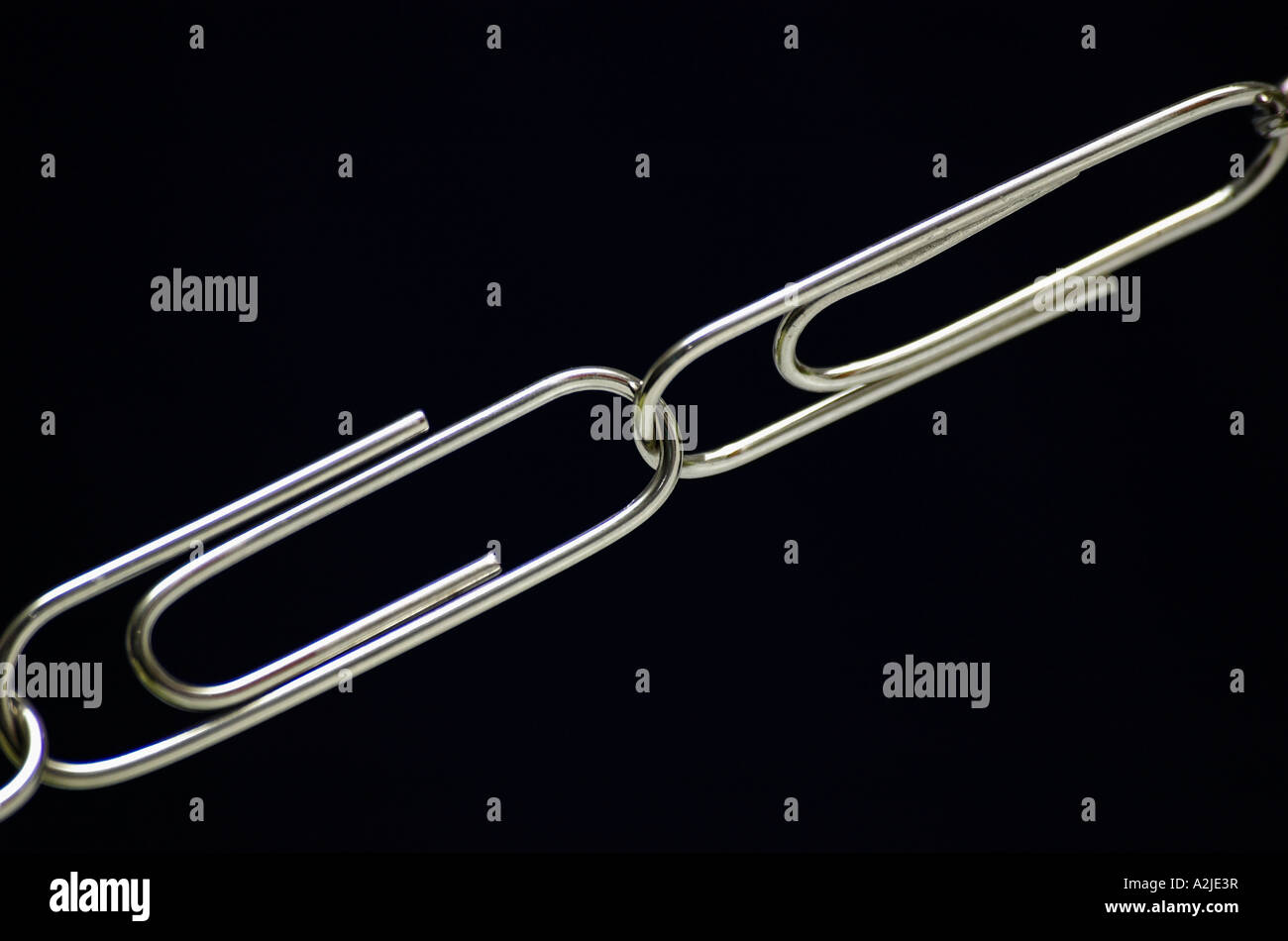 Close up of Two Linked Paper Clips Stock Photo Alamy