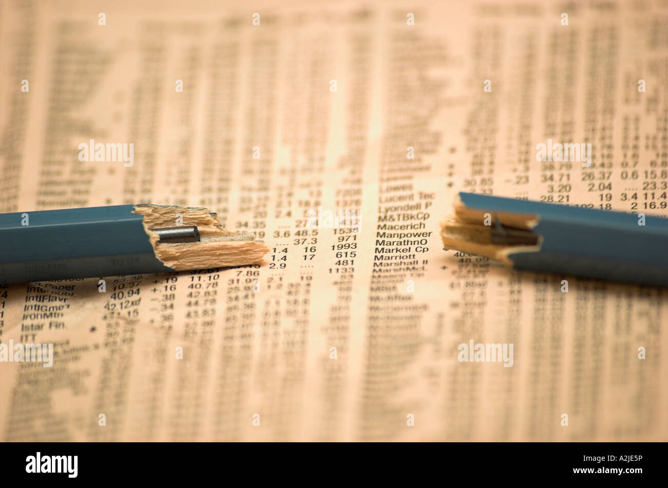 Broken pencil on financial newspaper Stock Photo