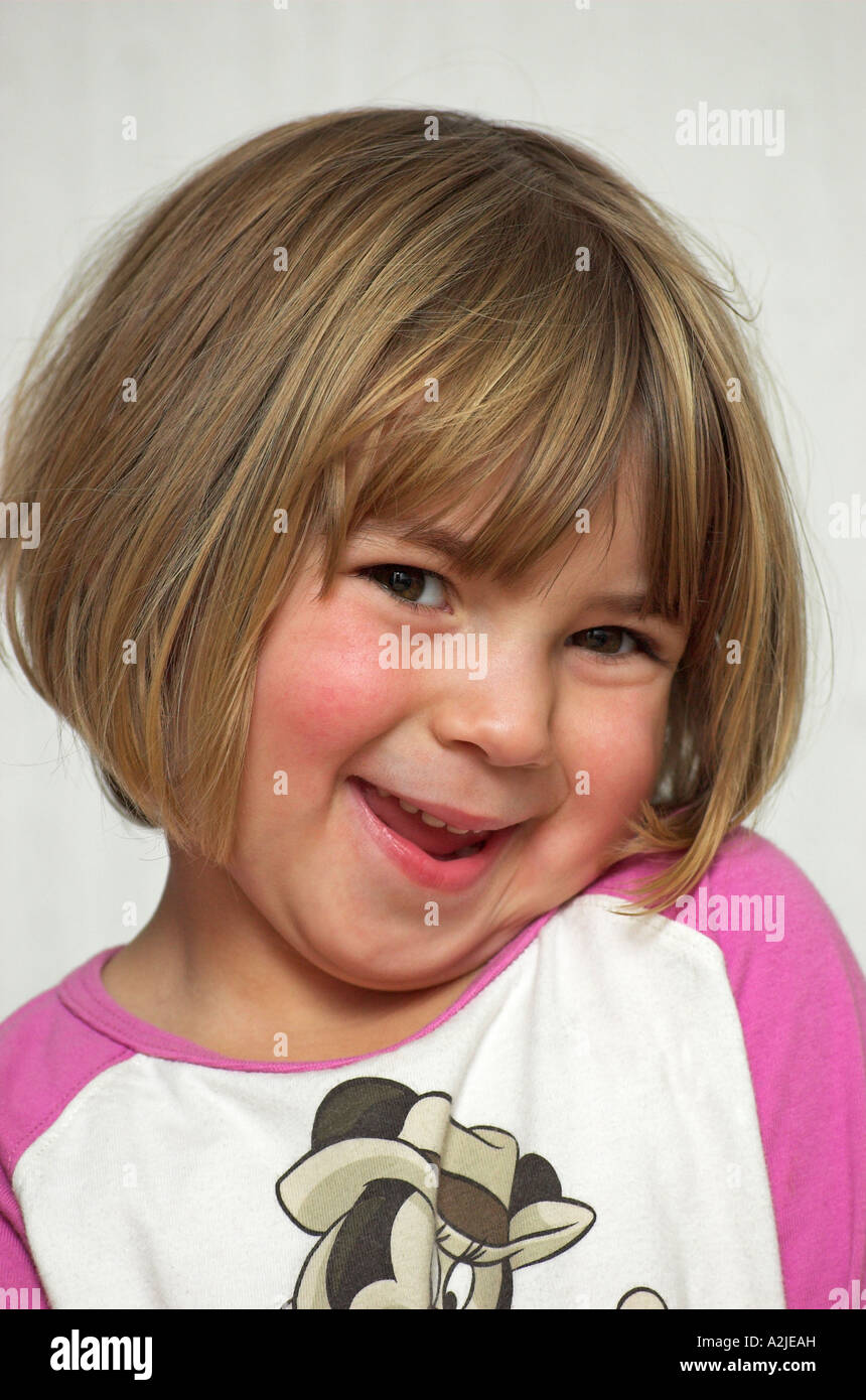 Portrait of a little girl with blonde hair smiling Stock Photo - Alamy