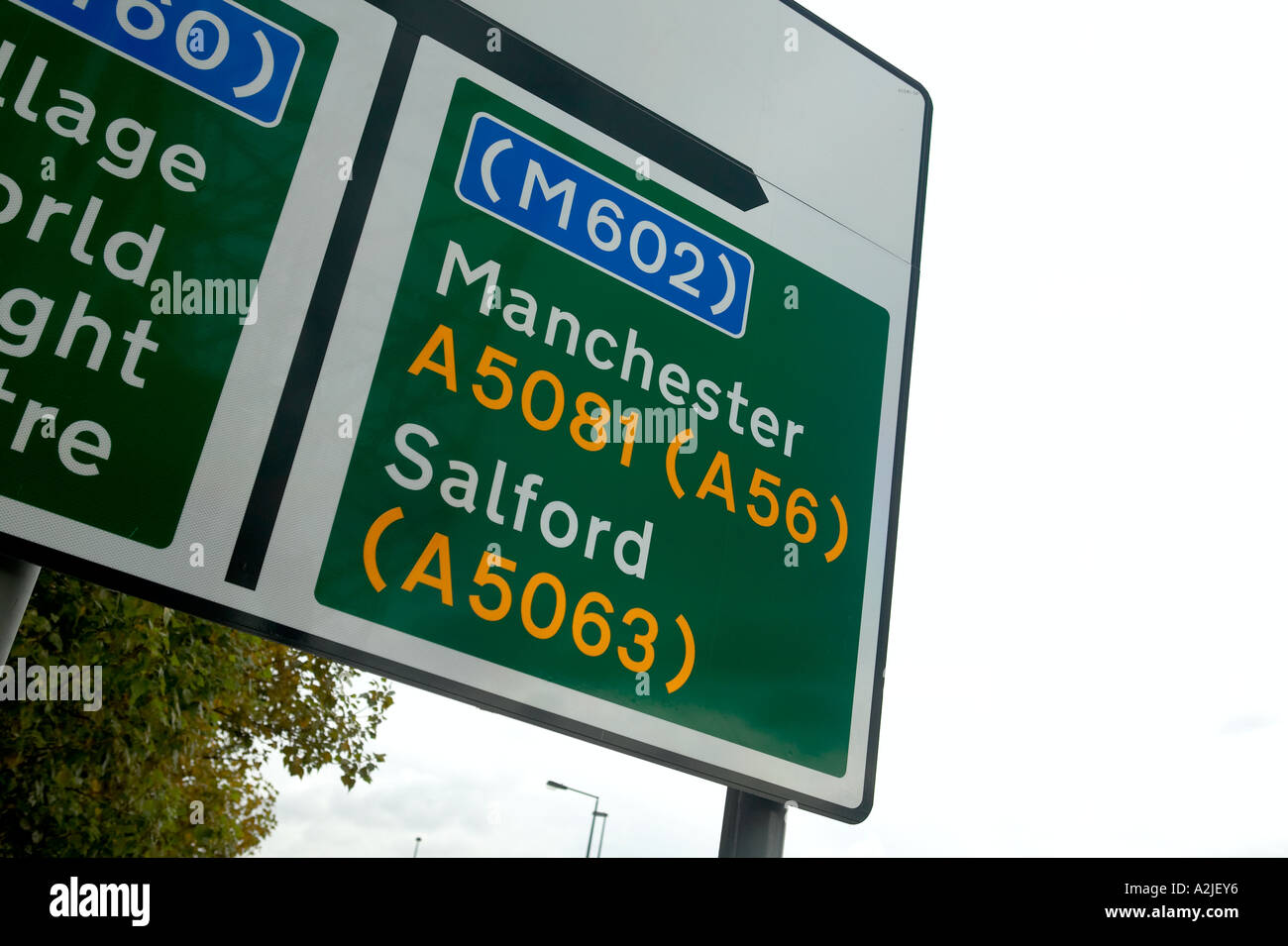 A street sign in central Manchester pointing to the M602 and Salford. Stock Photo