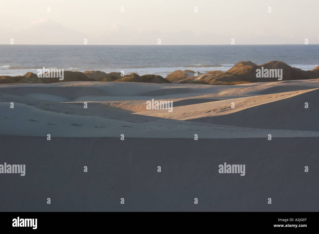 Sand dunes with ocean in background hi-res stock photography and images ...