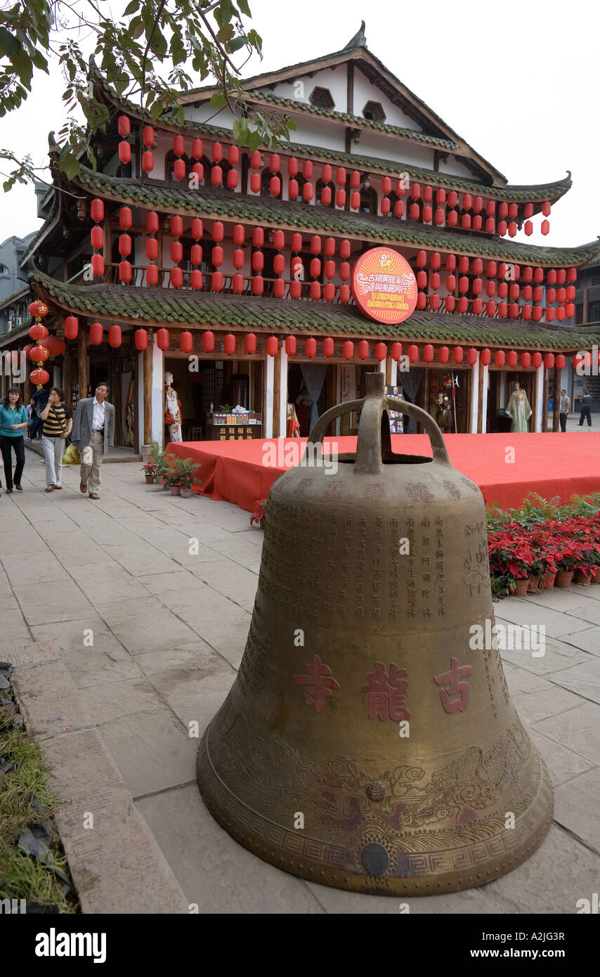 Old brass bell in the market square of a village near Chengdu in China Stock Photo