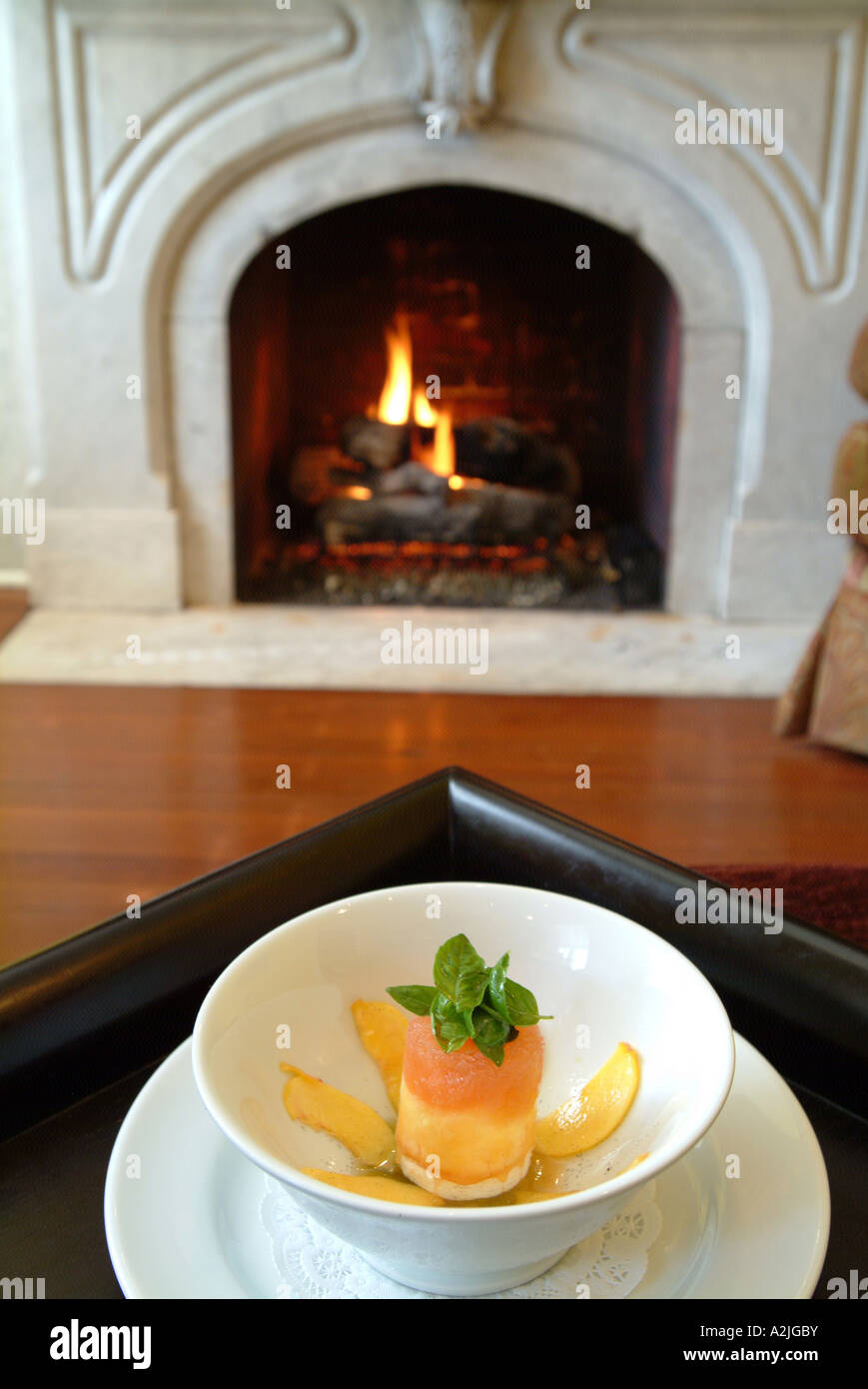 Peach sorbet vanilla ice cream and basil syrup A dessert at the Inn at Easton in their sitting room Stock Photo
