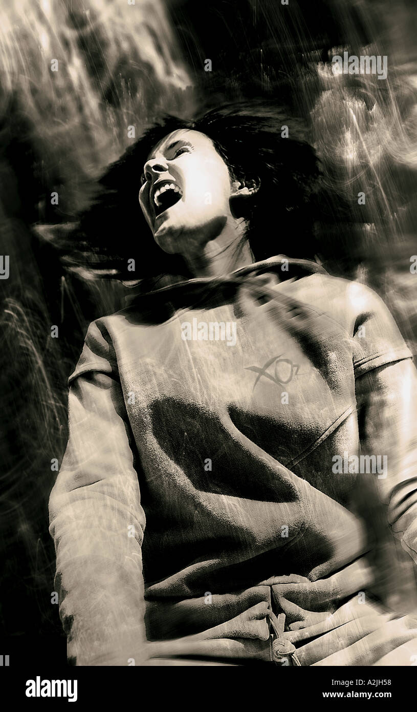 White European female age 20-25 wearing sportswear/skiing clothing and shouting Stock Photo