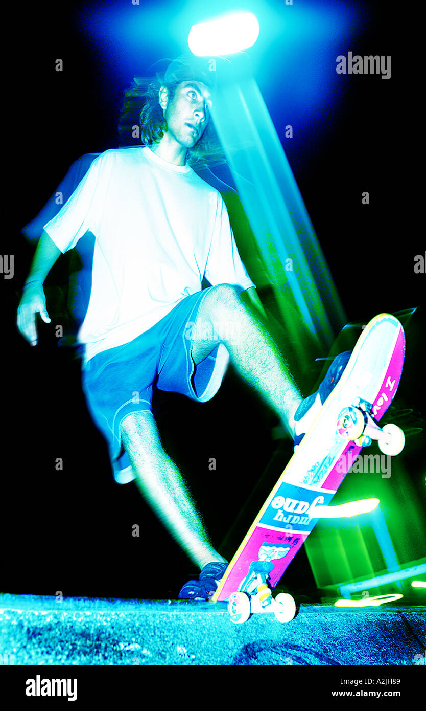 white solo Skateboarder at night riding a skate park in Brazil at night